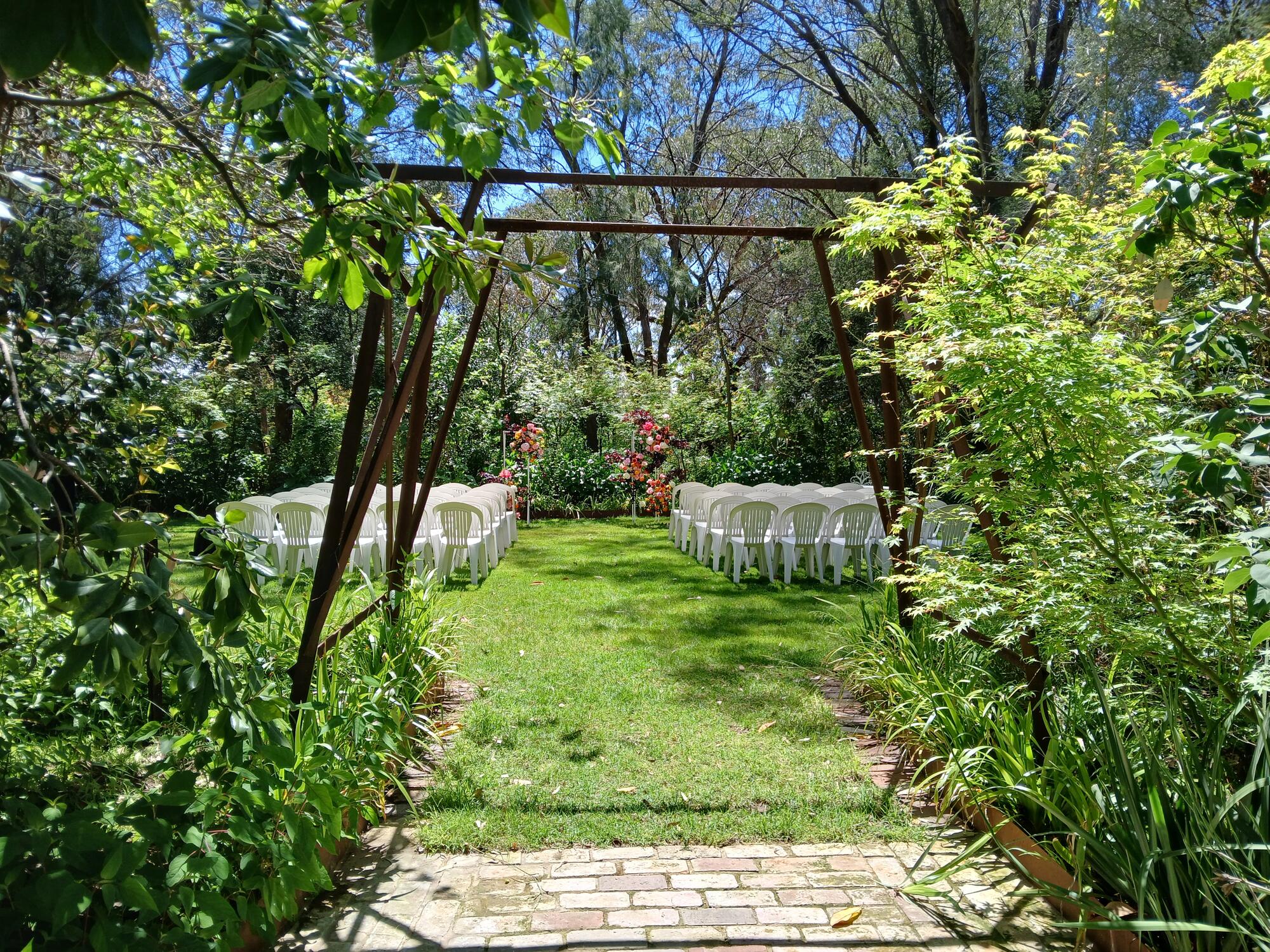 Ceremony chairs under the garden arch